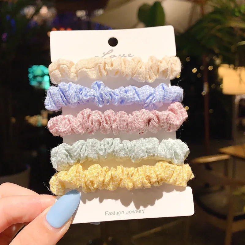 Children's hair ring and head rope set showing 20-piece and 6-piece dark packs in various colours.