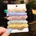 Children's hair ring and head rope set showing 20-piece and 6-piece dark packs in various colours.
