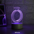 3D LED night light showing holographic diamond ring with colour-changing glow on a black base.