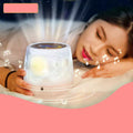 Pruixin rotating star projector night light projecting galaxy patterns on a bedroom ceiling.