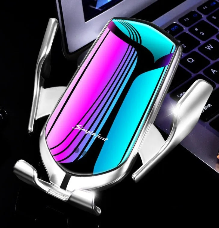 Magic Clip R1 wireless charging car phone holder in gold mounted on a car dashboard.