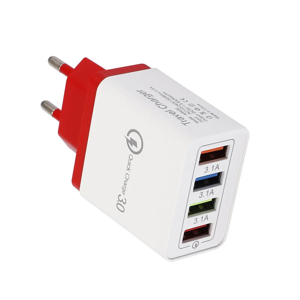 Simple Luminous 4-port USB wall charger in dark blue, plugged into a socket with four cables connected.