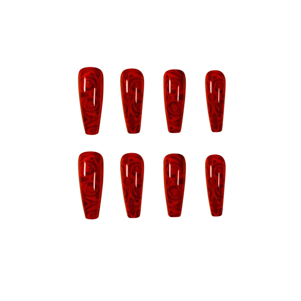 Pack of 24 wine red rose wearing nail art finished product tablets with glue on a manicure table