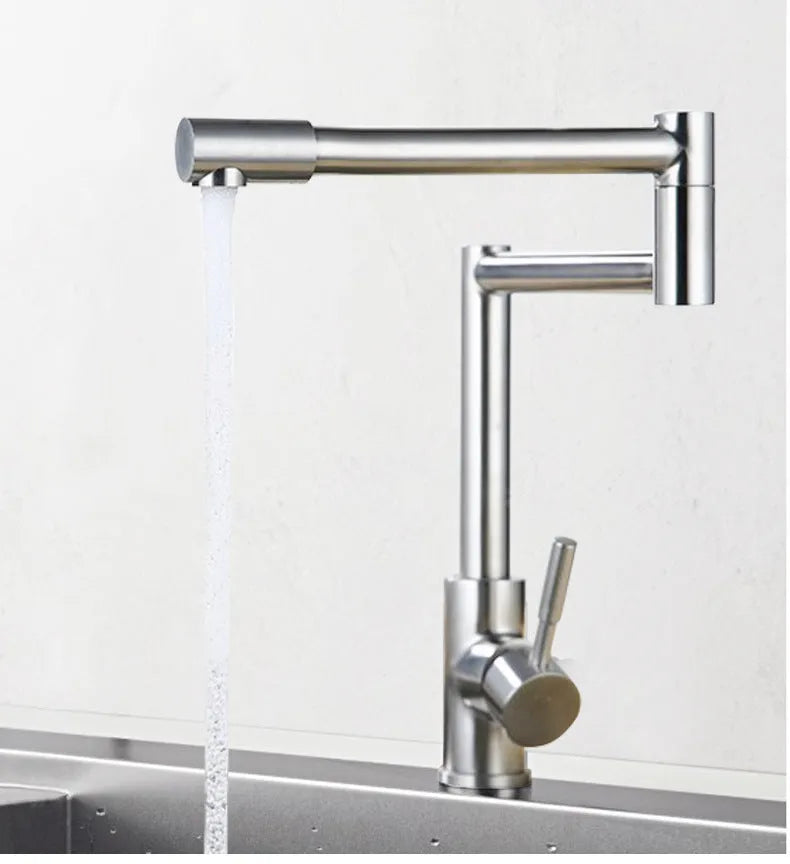 Silver stainless steel kitchen tap with dual handles and 360-degree rotating spout
