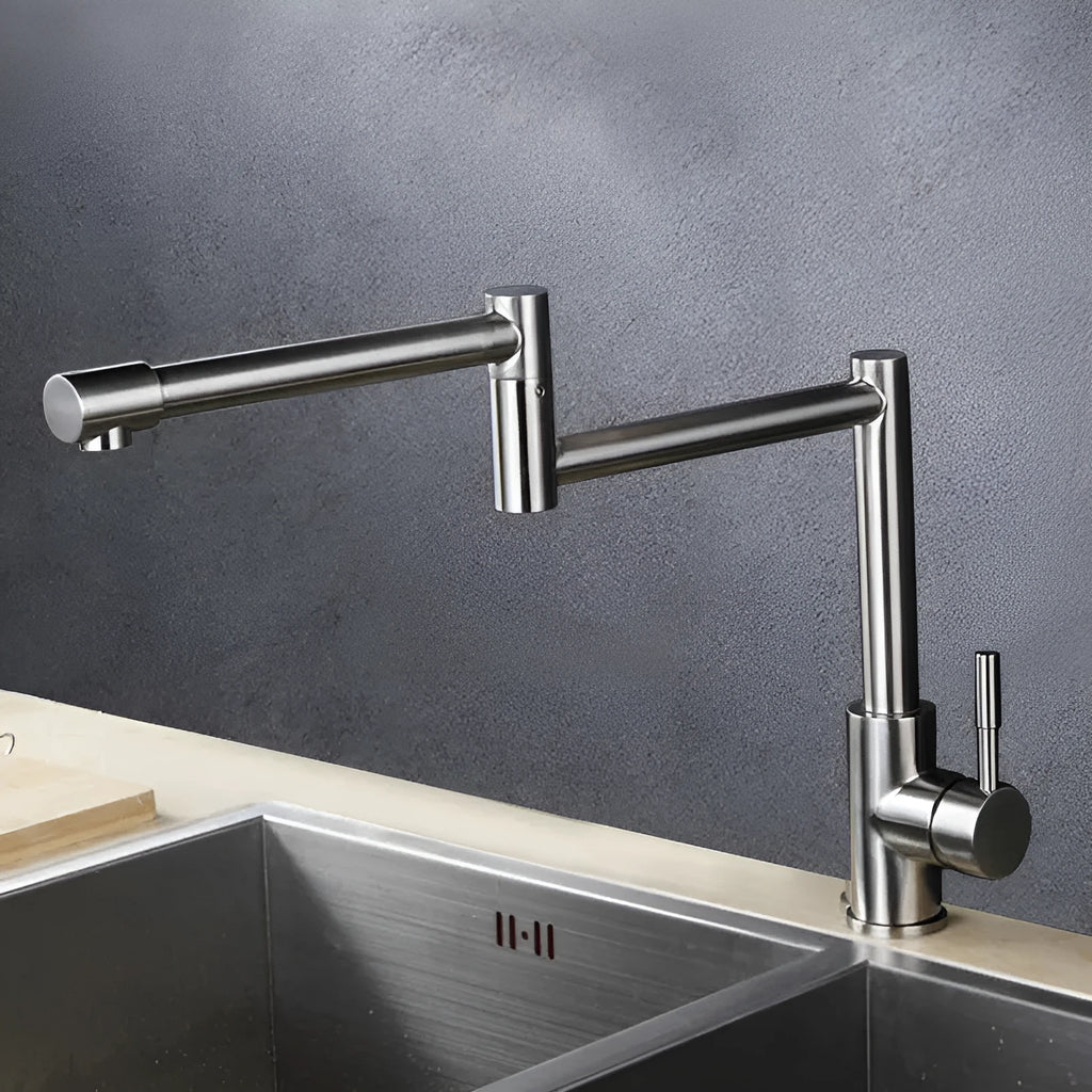 Silver stainless steel kitchen tap with dual handles and 360-degree rotating spout