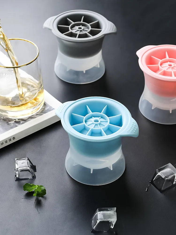 Flexible silicone ice tray making large hockey puck, round, and pentagon shaped ice cubes in assorted colours.