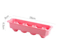 Flexible silicone ice tray making large hockey puck, round, and pentagon shaped ice cubes in assorted colours.