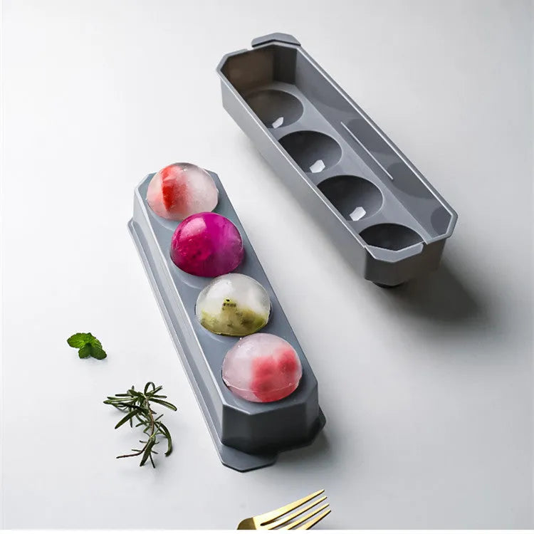 Flexible silicone ice tray making large hockey puck, round, and pentagon shaped ice cubes in assorted colours.