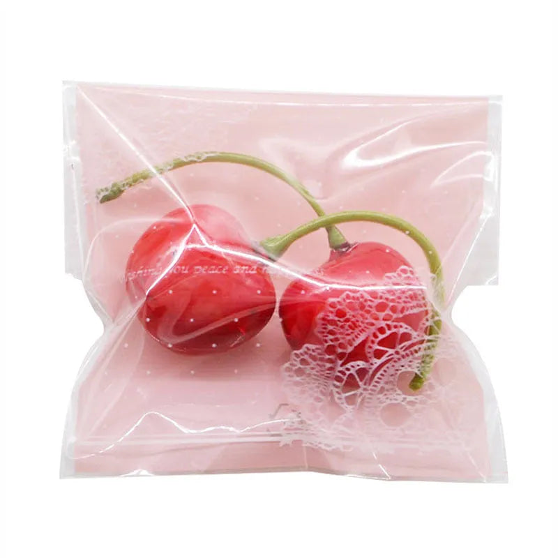 Pink self-adhesive plastic bag with resealable flap for packaging handmade soap, shown sealed.