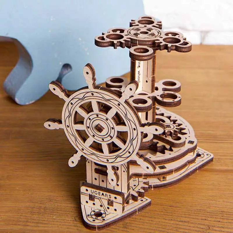 Ukrainian wooden machinery model pen holder with rotating base and 12 slots, in photo-colour finish.