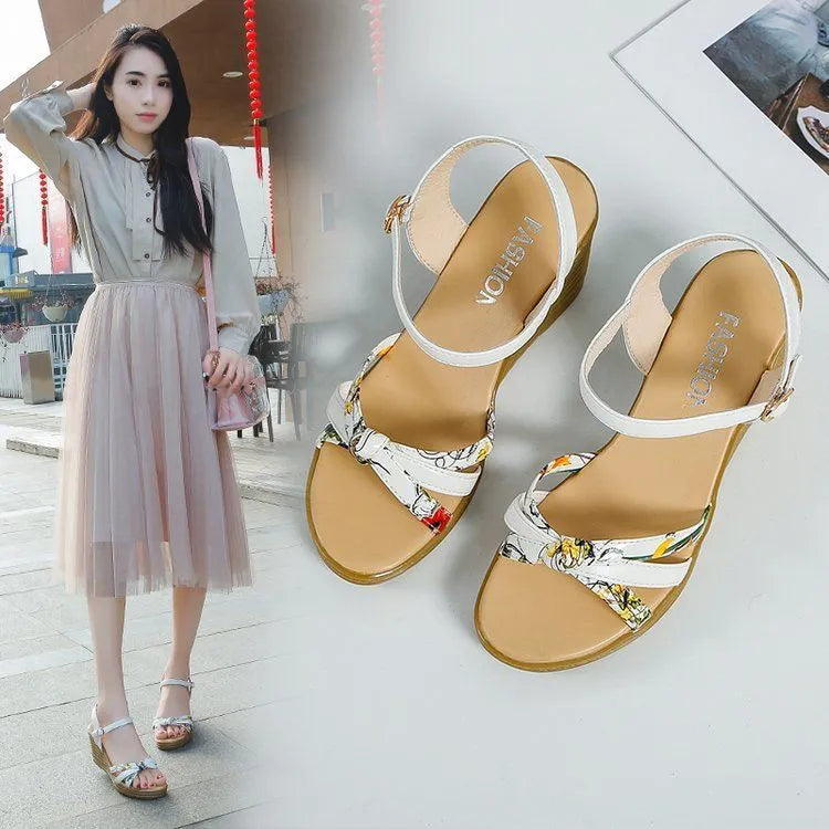 Pink women's wedge heel sandals with an adjustable buckle on a white background, showing the non-slip sole pattern.