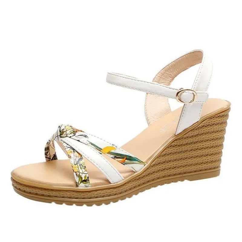 Pink women's wedge heel sandals with an adjustable buckle on a white background, showing the non-slip sole pattern.