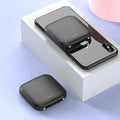 Compact black plastic power bank with an LED flashlight, showing its size and design.