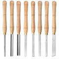 Open wooden case displaying eight different steel woodturning tools: gouges, chisels, and scrapers for lathe work.