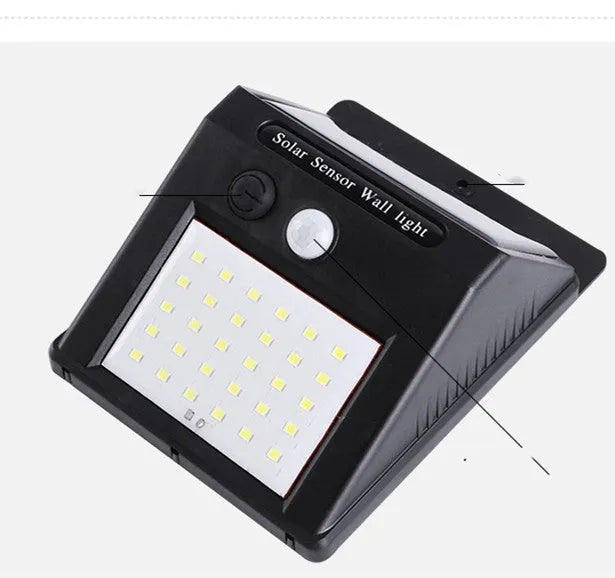 Solar outdoor garden lamp with LED lights and motion sensor in garden setting