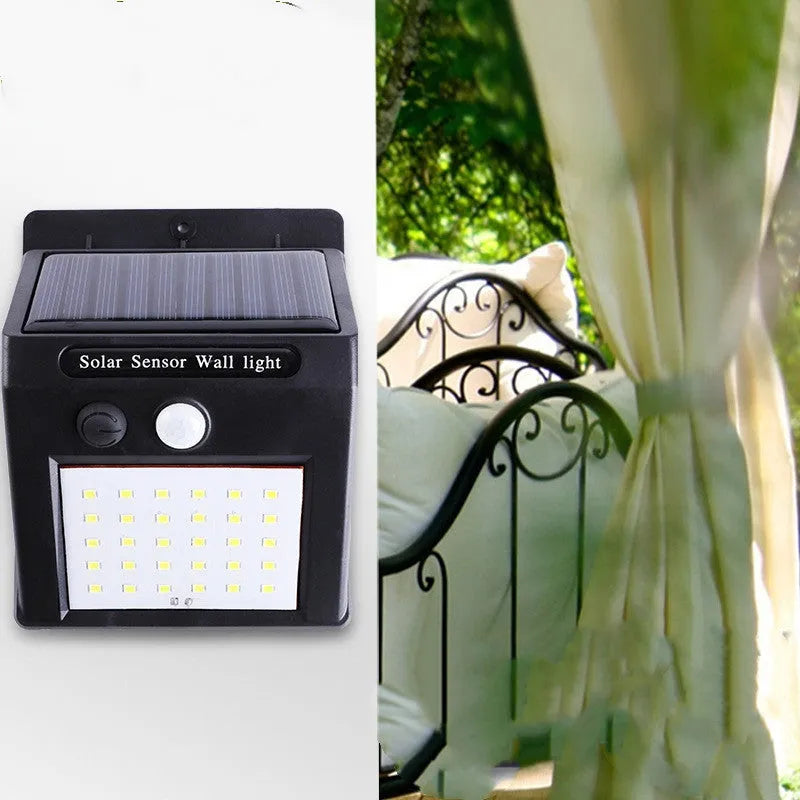 Solar outdoor garden lamp with LED lights and motion sensor in garden setting