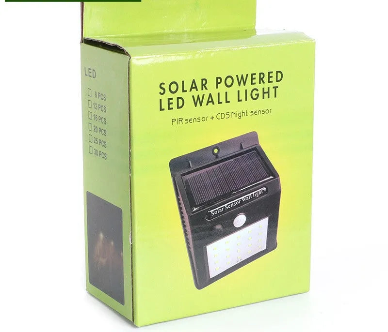 Solar outdoor garden lamp with LED lights and motion sensor in garden setting