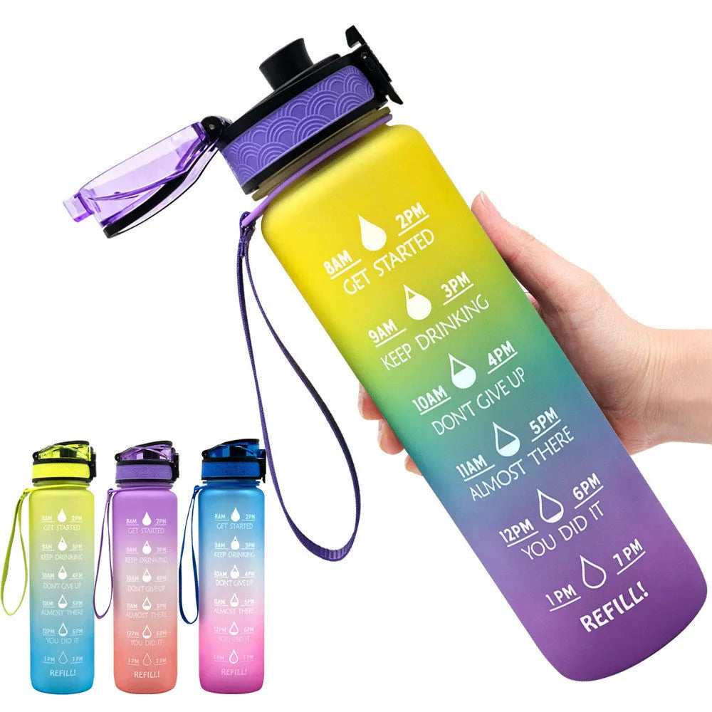 Blue-red gradient 1L Tritan water bottle with time markers and flip-top lid on a gym bag
