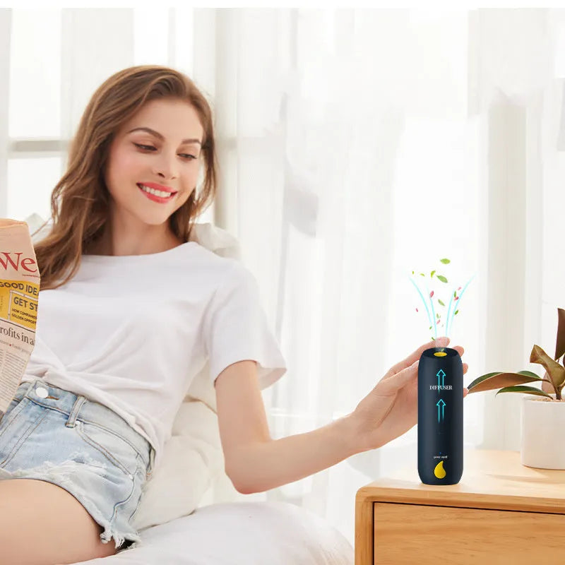 50ml timed automatic spray aromatherapy diffuser in white and green, wall-mounted, with a columnar shape