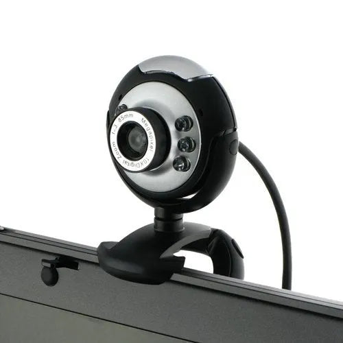 A black computer webcam with a ring of six LED lights around the lens, shown on a desktop.