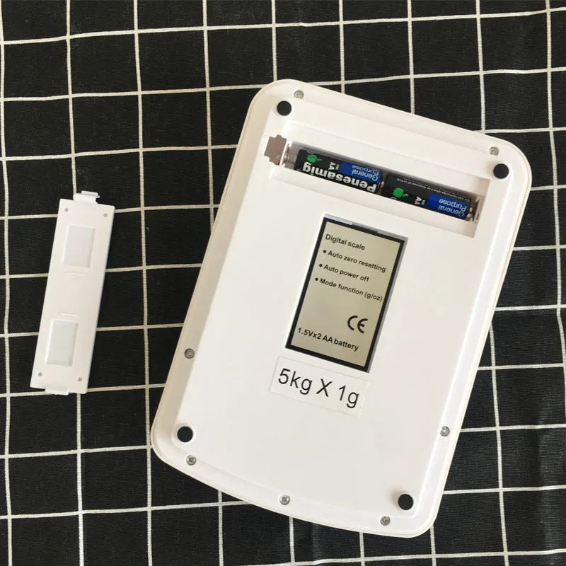 SF-400A model digital electronic kitchen scale on a countertop, showing a digital display.