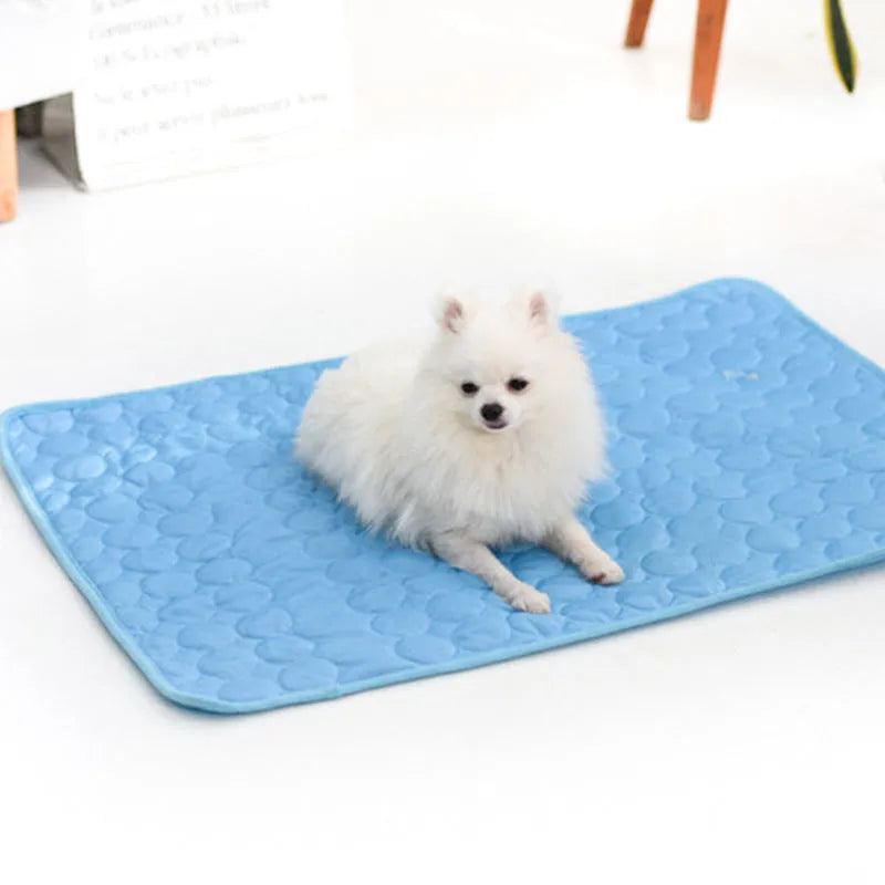 Ice silk and mesh pet cooling mat in brown, blue, gray, or pink, foldable for doghouse, cage, or floor use