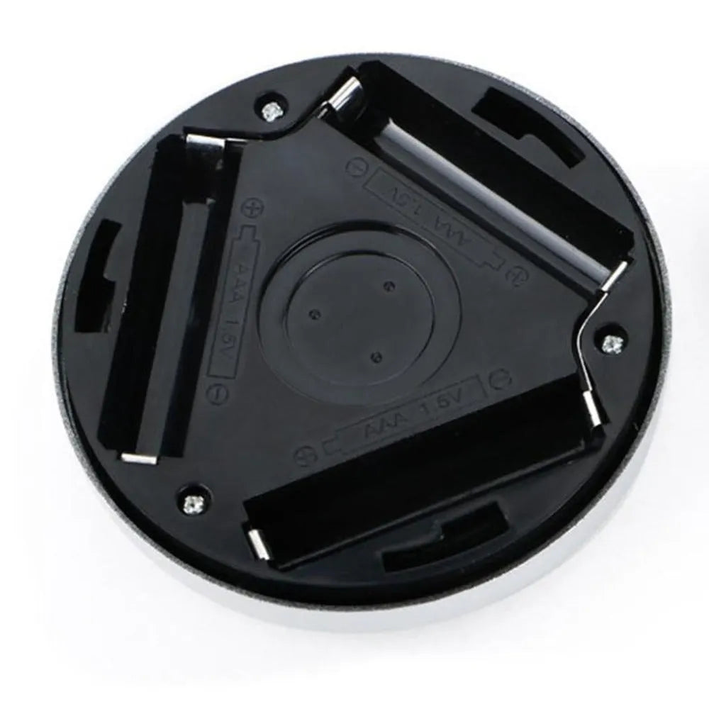 Square black wireless motion sensor night light on a surface, showing compact 80mm size.