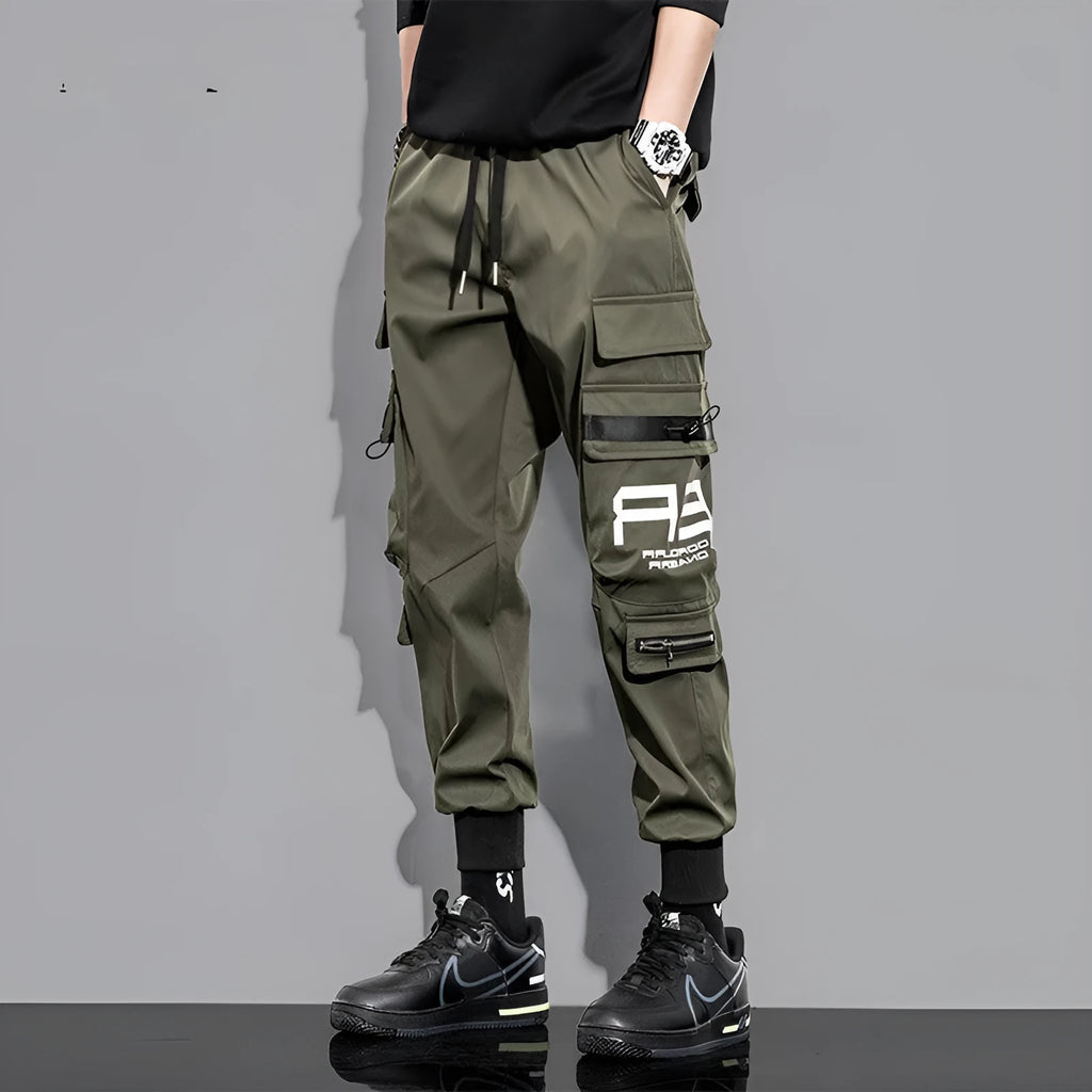 Men's outdoor sports trousers in green with small-foot leg and pocket detail, micro-elastic fabric, non-iron finish