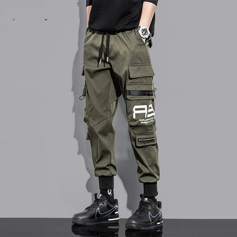 Men's outdoor sports trousers in green with small-foot leg and pocket detail, micro-elastic fabric, non-iron finish