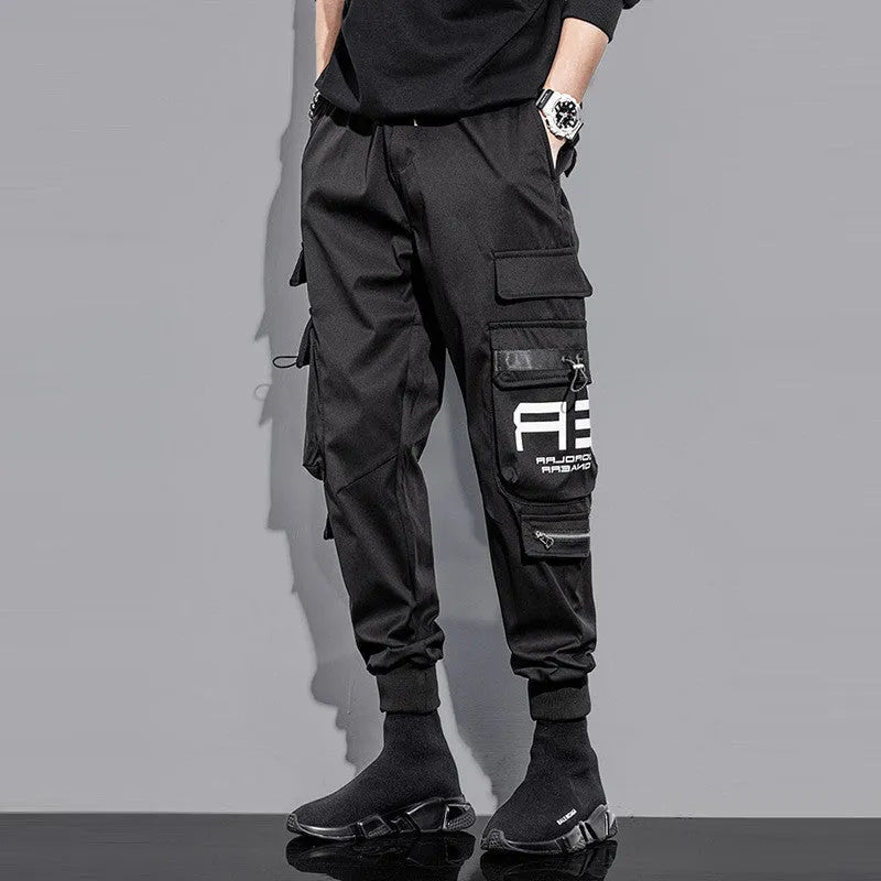 Men's outdoor sports trousers in green with small-foot leg and pocket detail, micro-elastic fabric, non-iron finish