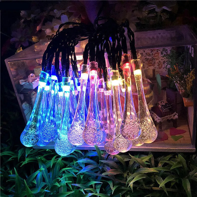 Solar LED string lights with bubble drop pendants for outdoor garden decoration