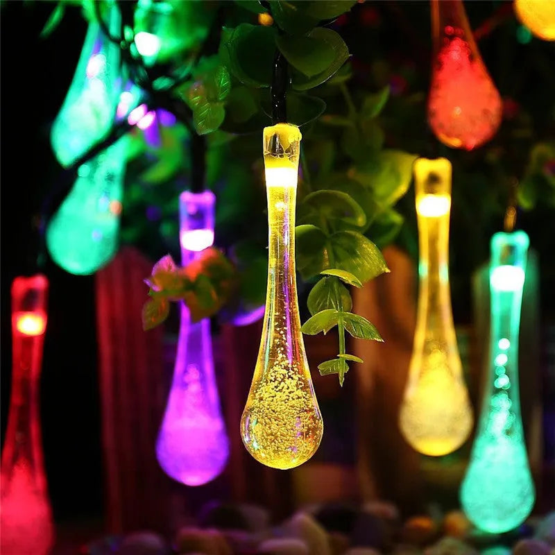 Solar LED string lights with bubble drop pendants for outdoor garden decoration