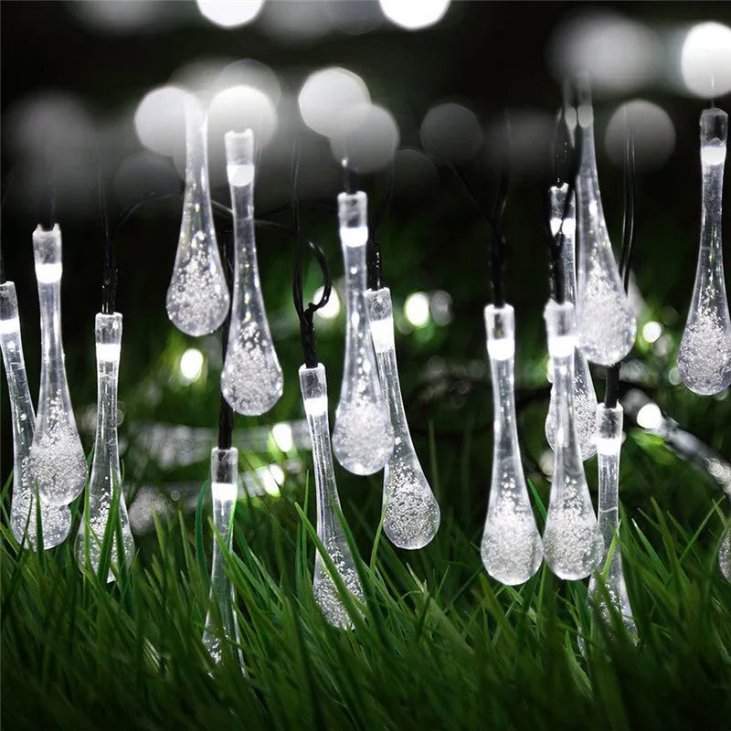 Solar LED string lights with bubble drop pendants for outdoor garden decoration