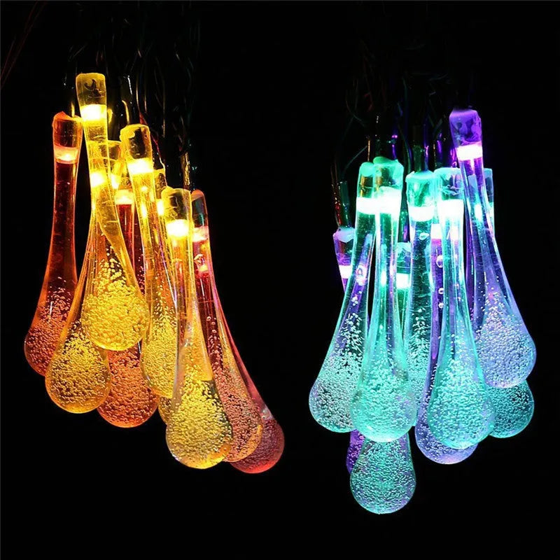 Solar LED string lights with bubble drop pendants for outdoor garden decoration