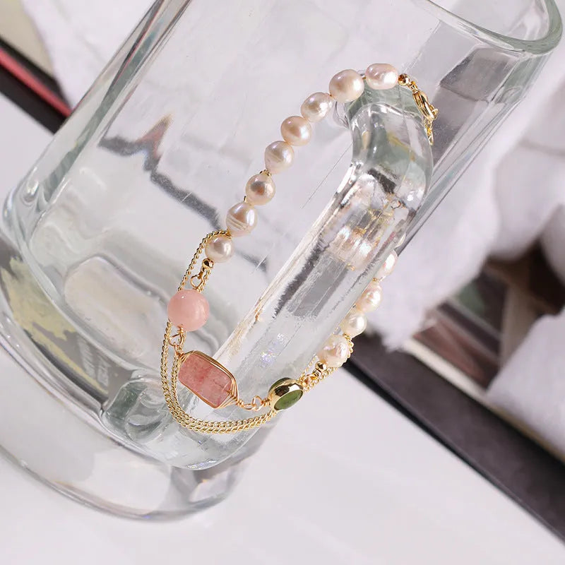 Women's pink freshwater pearl bracelet with geometric design and strawberry crystal charms