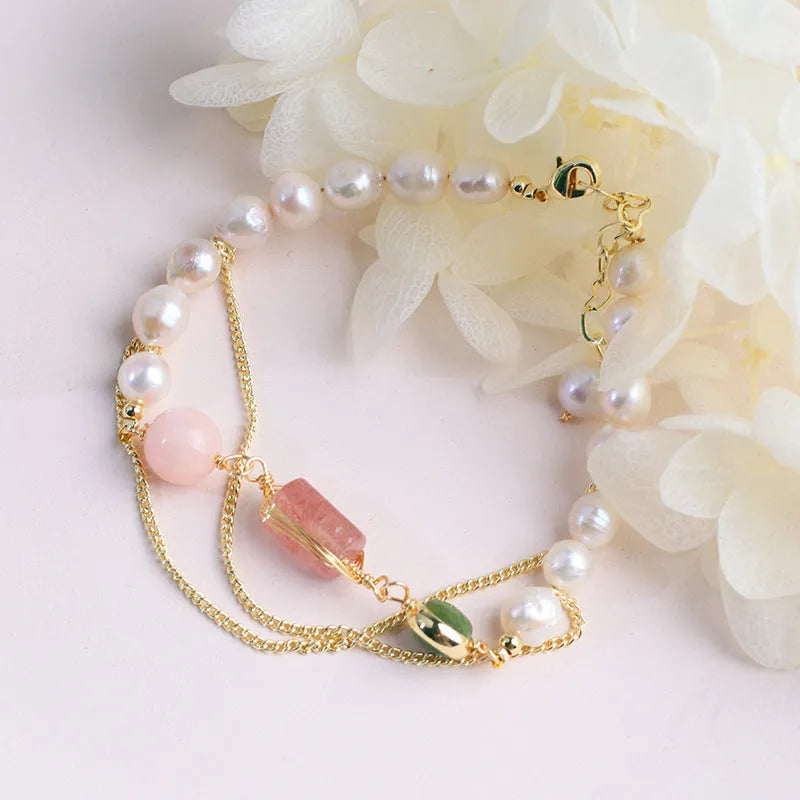 Women's pink freshwater pearl bracelet with geometric design and strawberry crystal charms