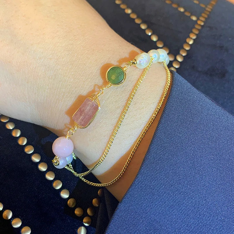 Women's pink freshwater pearl bracelet with geometric design and strawberry crystal charms