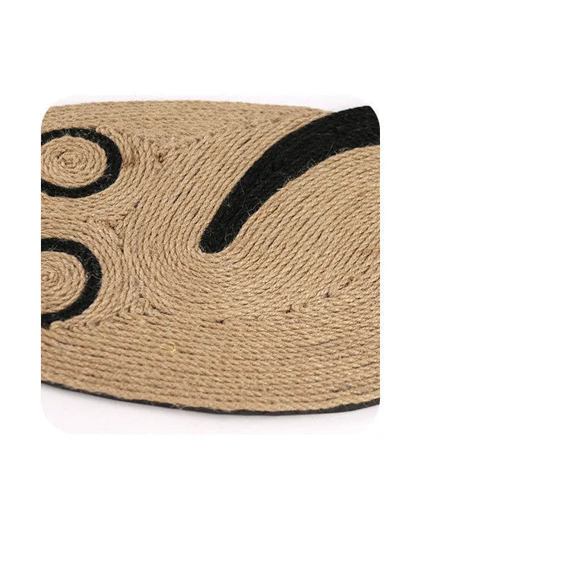 Mouse-shaped sisal cat scratching board on floor; natural fibre texture visible