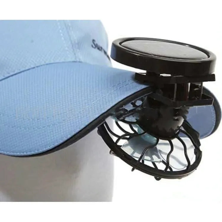A black clip-on solar panel fan for outdoor cooling during camping or fishing.