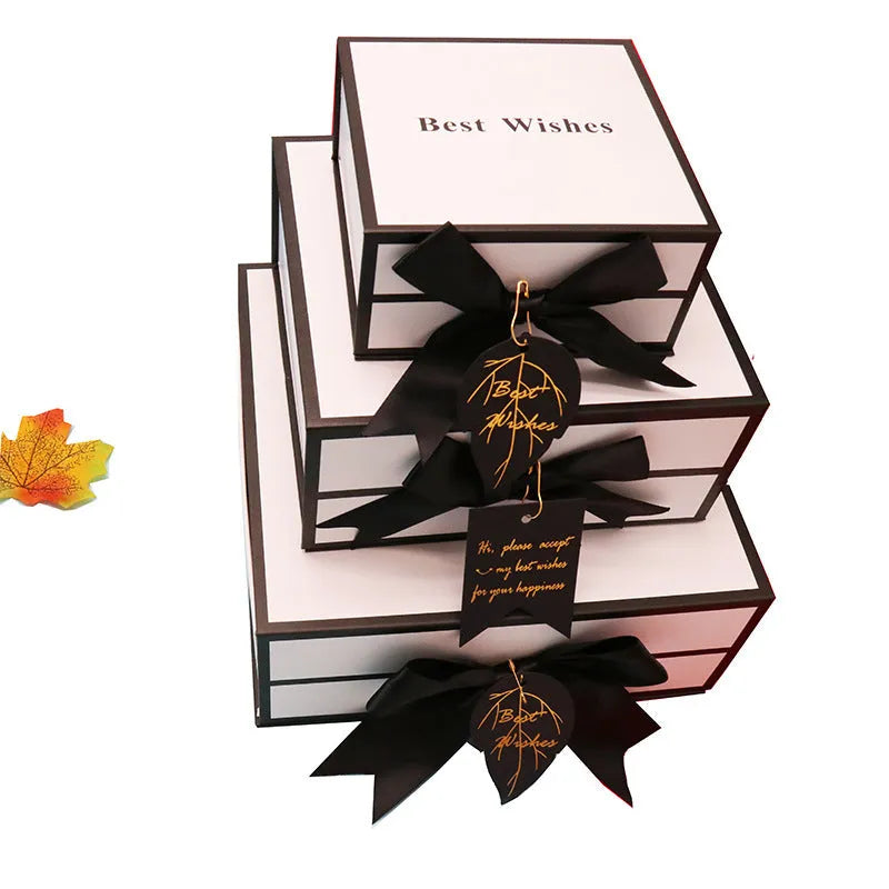 White square clamshell book gift box for lipstick cosmetics, 12x12x6cm size with lid open, on plain background