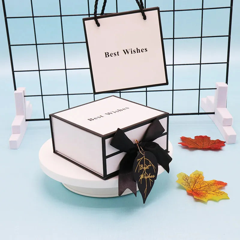 White square clamshell book gift box for lipstick cosmetics, 12x12x6cm size with lid open, on plain background