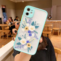 iPhone case with blue flower cartoon design and contrasting pink matte frame on a mobile phone.
