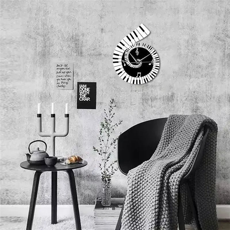 Irregular shaped wall clock with treble clef, piano keyboard and musical note design elements in black and white