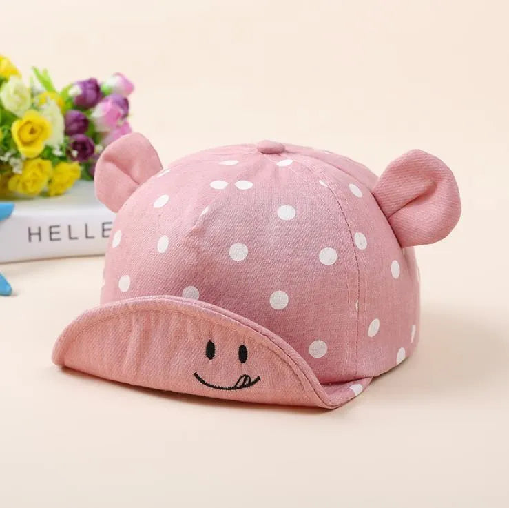 Baby baseball cap with short brim and dome top, available in five colours and sizes 6 months to 2 years.