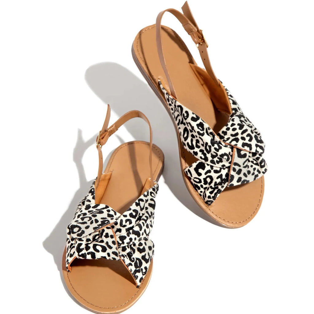 Women denim blue flat sandals with low heel beach slippers on casual setting