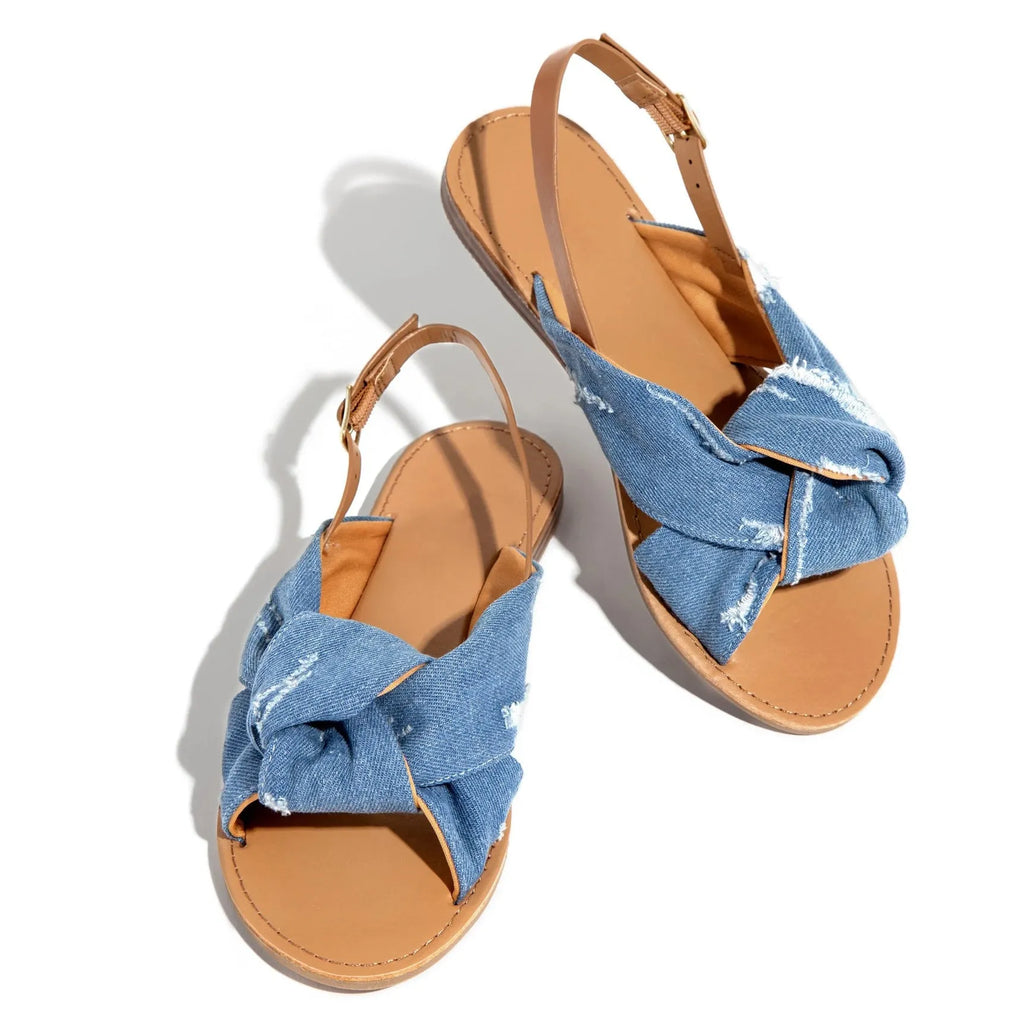 Women denim blue flat sandals with low heel beach slippers on casual setting