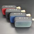 Square portable Bluetooth speaker with USB and U disk playback, 117x79x39mm, available in black, blue, green, grey, and red.