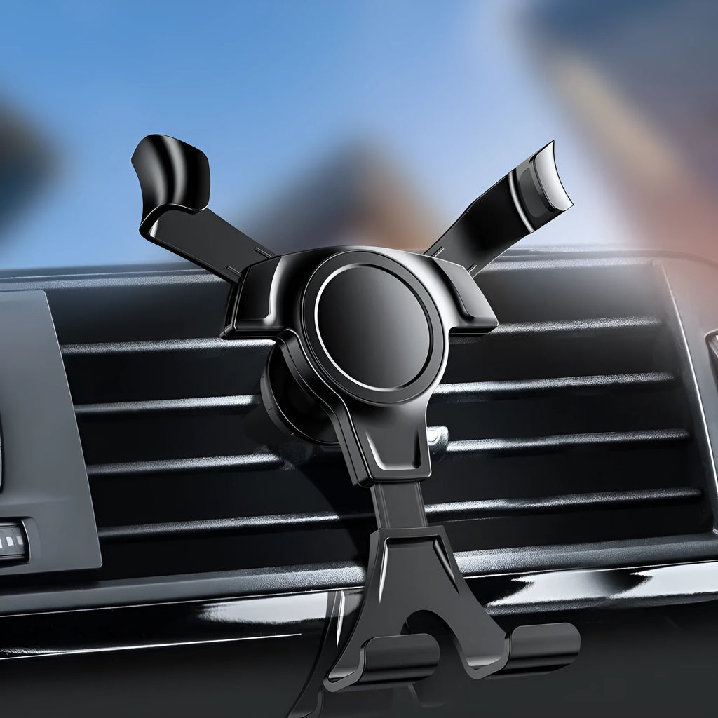 Black plastic car phone holder clipped to a car air vent with a smartphone inserted