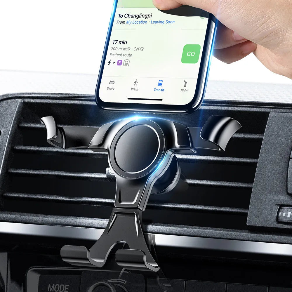 Black plastic car phone holder clipped to a car air vent with a smartphone inserted