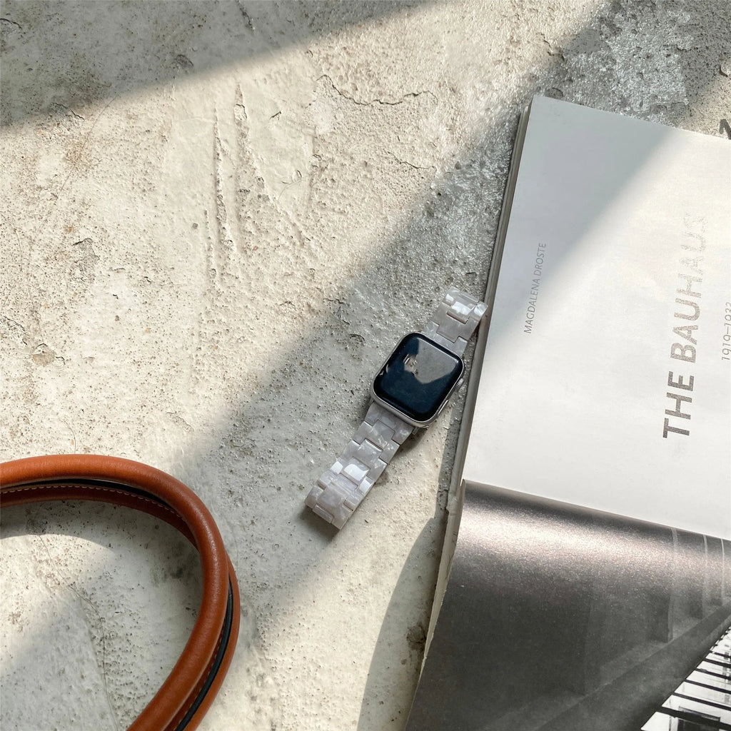 White shell pattern environmentally friendly resin Apple Watch strap shown on Apple Watch